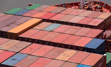Urban gravity in the global container shipping network